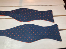 Load image into Gallery viewer, Navy blue and dark orange polka dot cotton, self tie bow tie , butterfly styled adjustable with up to 20&quot;  neck