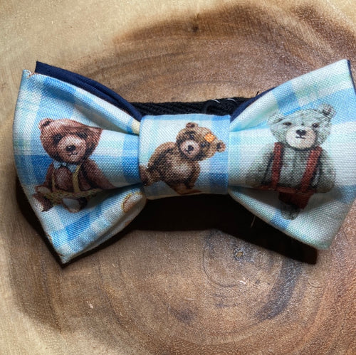 He's a little teddy bear. This bow tie is cute as a button and features an adorable bear.