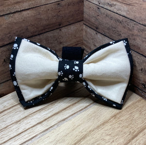 Our signature, dapper pet Bowtie, featuring a black and white paw, print and white accent Bowtie