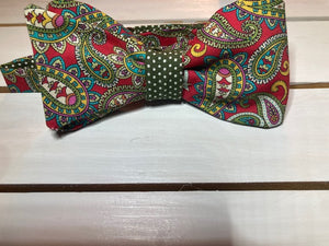 Red and olive Green paisley  self tie bow tie with classic small olive green polka dot print on reverse.