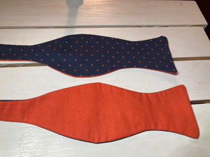 Navy blue and dark orange polka dot cotton, self tie bow tie , butterfly styled adjustable with up to 20"  neck