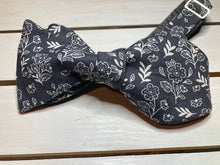 Load image into Gallery viewer, Grey and white floral cotton print bow tie, butterfly styled with up to 20 inch adjustable neck.