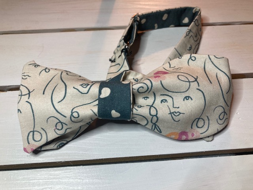 Smiling faces  and slate blue  double sided self tie bow tie , butterfly style with up to 20inch neck