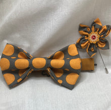 Load image into Gallery viewer, Dark grey and Burnt orange polka dot cotton bow tie with coordinated cotton strap and lapel pin