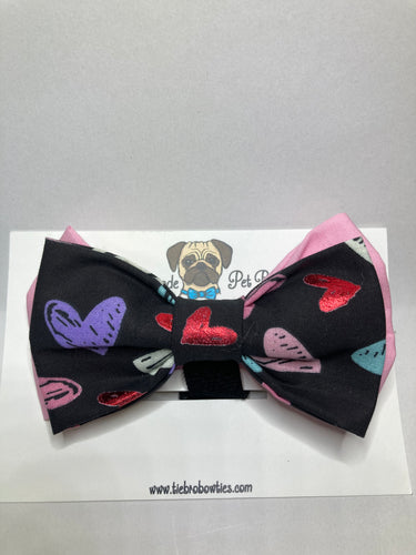 Black colored with pastel and foil hearts cotton valentines themed pet bow tie with Velcro closure